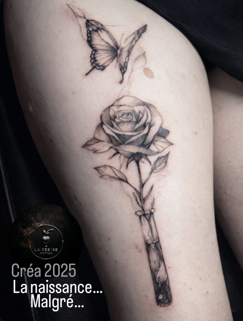 Tatouage rose fine line et papillon- la cerise tattoo à gland- tatoueur la côte
